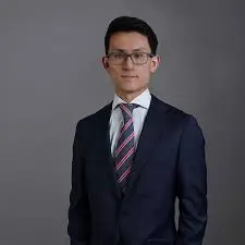 Professional businessman in suit posing for portrait.